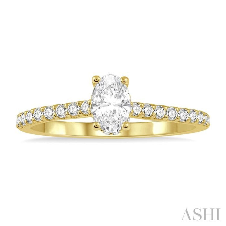1/2 Ctw Round Cut Diamond Engagement Ring With 1/4 Ct Oval Cut Center Stone in 14K Yellow Gold