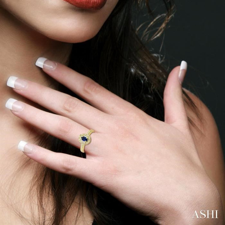 5x3 MM oval cut Sapphire and 1/10 Ctw Round Cut Diamond Ring in 14K Yellow Gold.