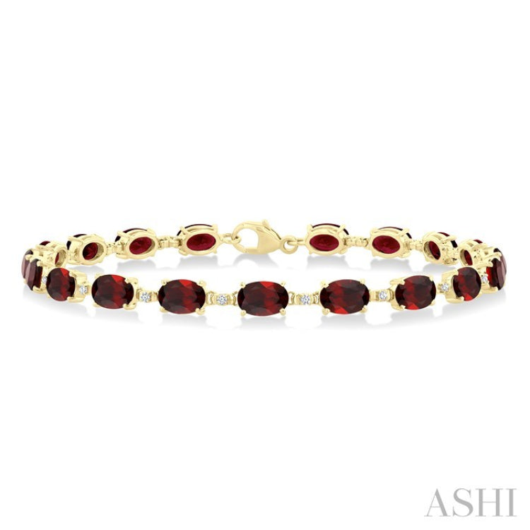 6X4 MM Oval Cut Garnet and 1/6 Ctw Round Cut Diamond Semi-Precious Tennis Bracelet in 10K Yellow Gold