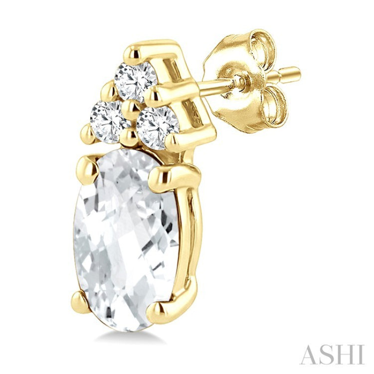 1/20 Ctw Oval Cut 5X3 MM White Topaz and Round Cut Diamond semi-precious Earrings in 10K Yellow Gold