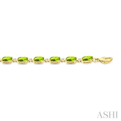6X4 MM Oval Cut Peridot and 1/6 Ctw Round Cut Diamond Semi-Precious Tennis Bracelet in 10K Yellow Gold