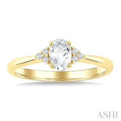 1/20 Ctw Oval Cut 6X4 MM White Topaz and Round Cut Diamond semi-precious Ring in 10K Yellow Gold