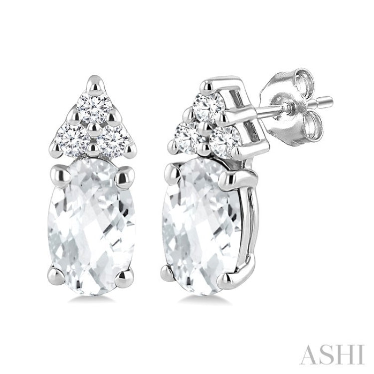 1/20 Ctw Oval Cut 5X3 MM White Topaz and Round Cut Diamond semi-precious Earrings in 10K White Gold