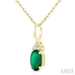 1/50 Ctw Oval Cut 6X4 MM Emerald and Round Cut Diamond Precious Pendant With Chain in 10K Yellow Gold