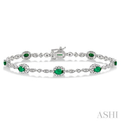 5x3 MM Oval Cut Emerald and 1/20 Ctw Round Cut Diamond Bracelet in 14K White Gold