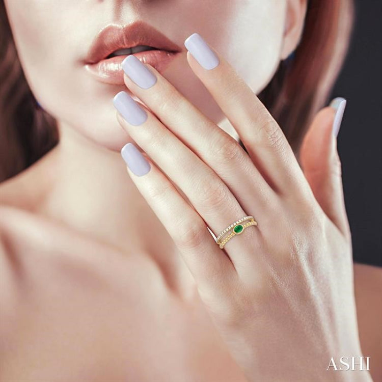 4x3 MM Oval Shape Emerald and 1/5 Ctw Round Cut DiamondsPrecious Fashion Split Twin Ring in 10K Yellow Gold